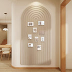 Felt pinboard in camel displaying photos on a softly lit wall.