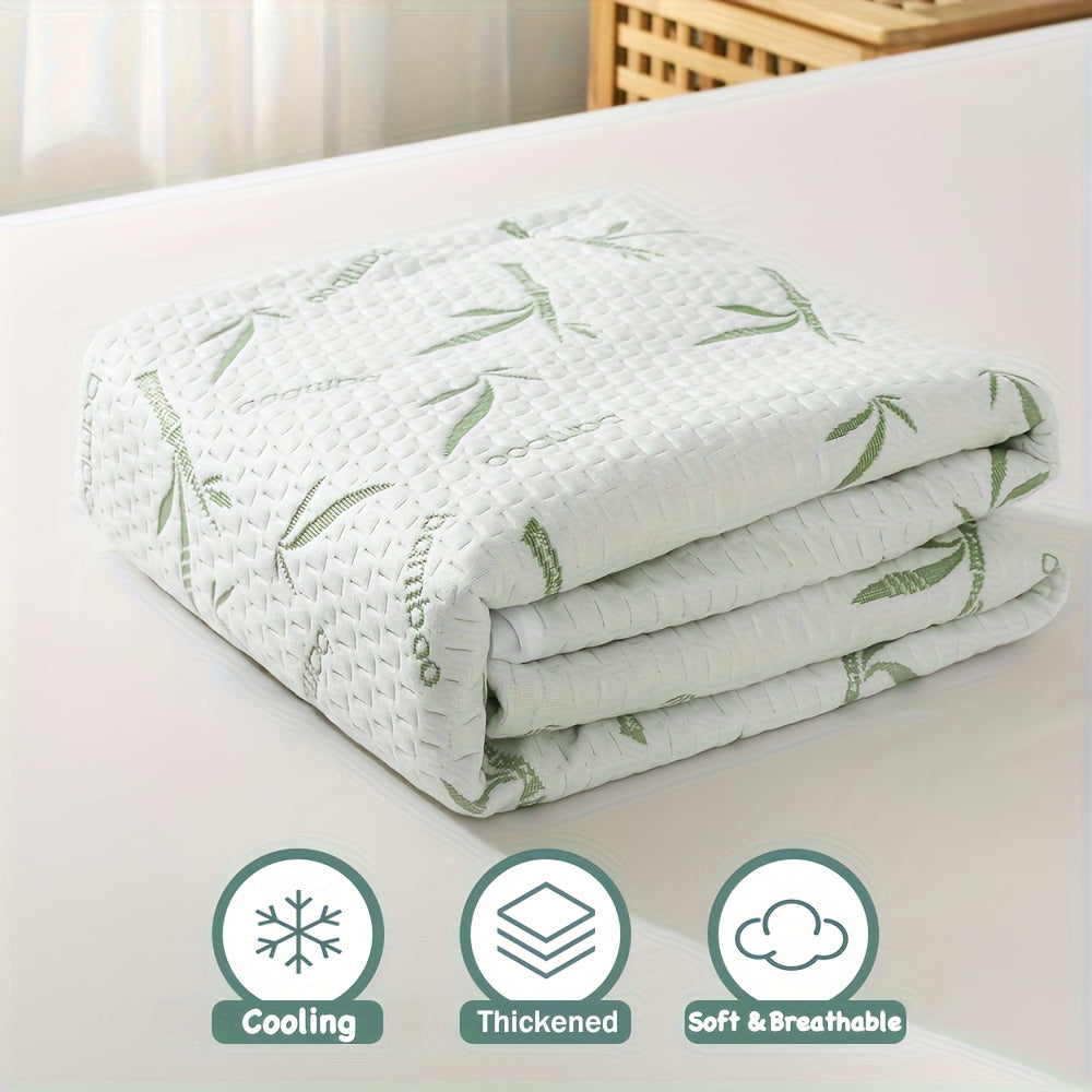 Fitted mattress protector folded beside illustrated feature badges