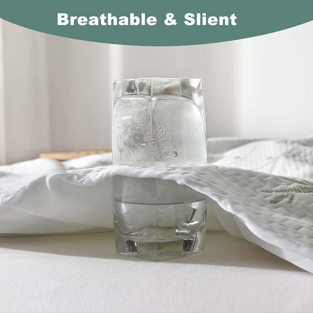Fitted mattress protector shown with a glass in a fabric demonstration