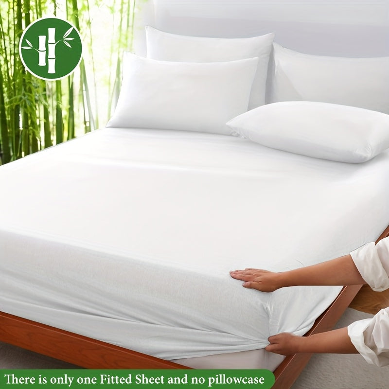 White fitted sheet being adjusted around a mattress corner