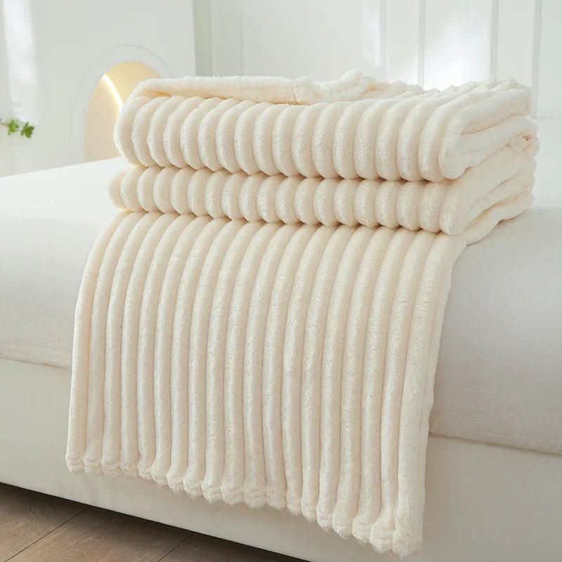 Flannel fleece blanket showing its soft striped surface and drape.