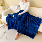 Blue ribbed flannel throw blanket across a seated person's lap