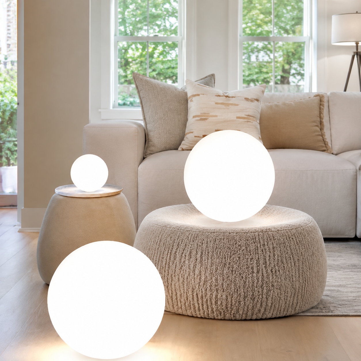Small and medium floating pool lights glowing in evening water