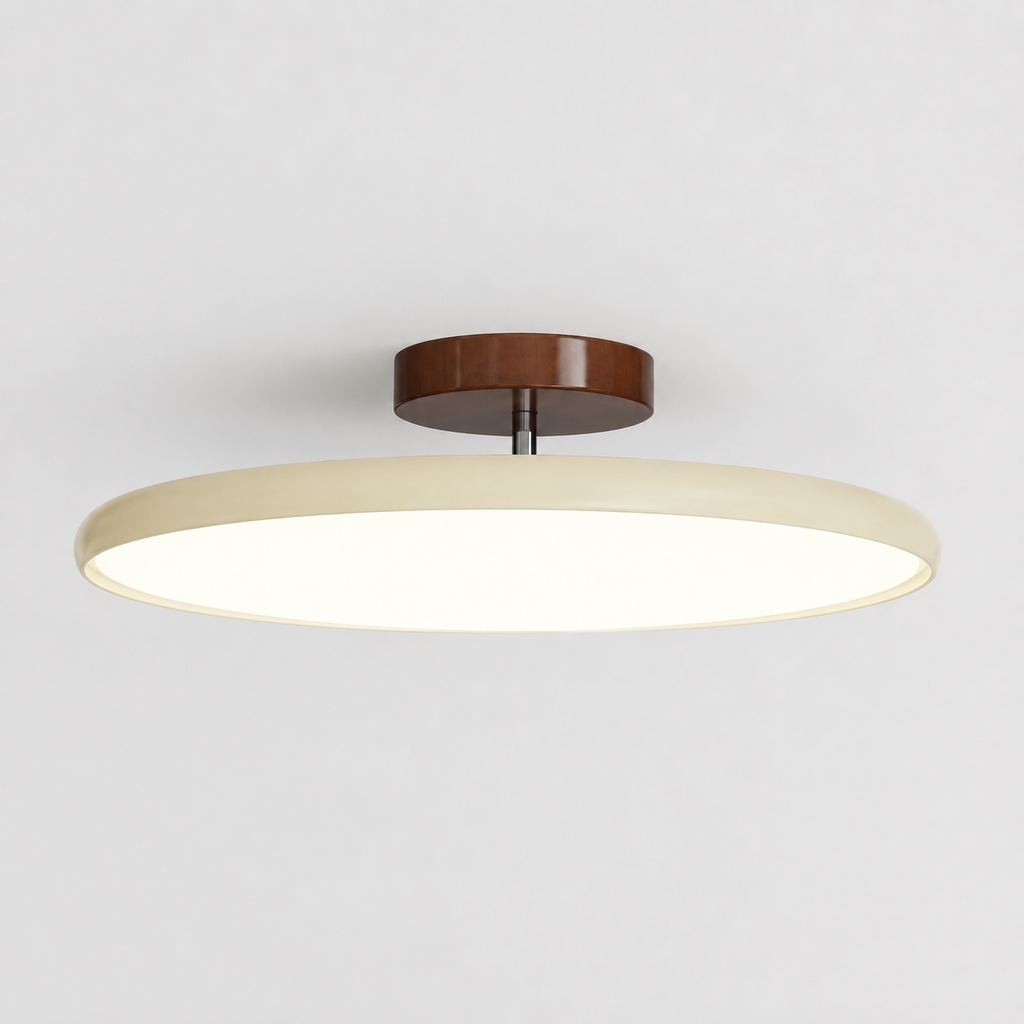 Round flush mount ceiling light with a brown canopy and glowing white ring on a neutral ceiling.