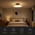 Round flush mount ceiling light glowing above a bed with feature icons below.