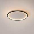 Circular flush mount ceiling light with a black rim and warm glowing ring on a neutral ceiling.