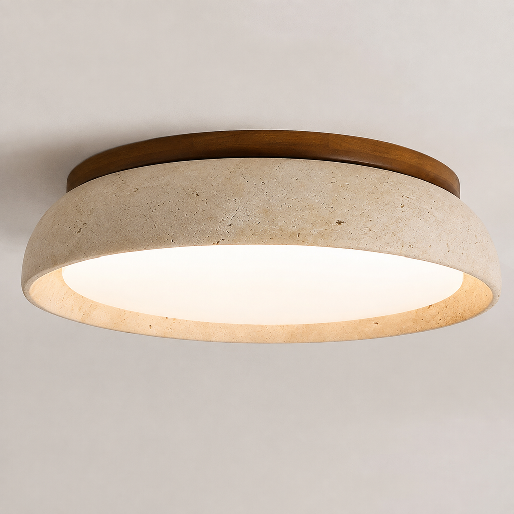 Close-up of a round flush mount ceiling light with a wood rim, textured beige shade, and warm glowing diffuser.