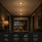 Gold flush mount ceiling light fixtures illuminate a dark hallway above a row of feature icons.