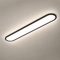 Black oval flush mount ceiling light glowing on a warm gray ceiling.