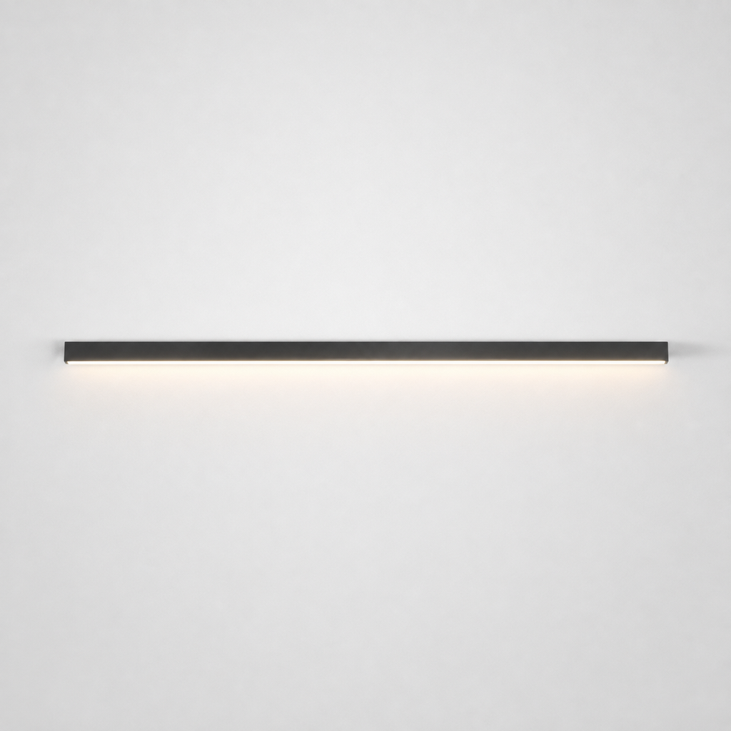 Slim black wall light mounted horizontally on a neutral wall with a soft downward glow.
