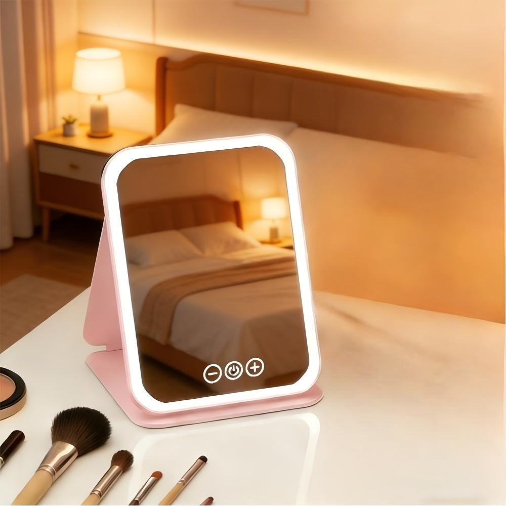 Pink illuminated makeup mirror with cosmetics