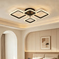 Black four diamond LED ceiling light above a bedroom