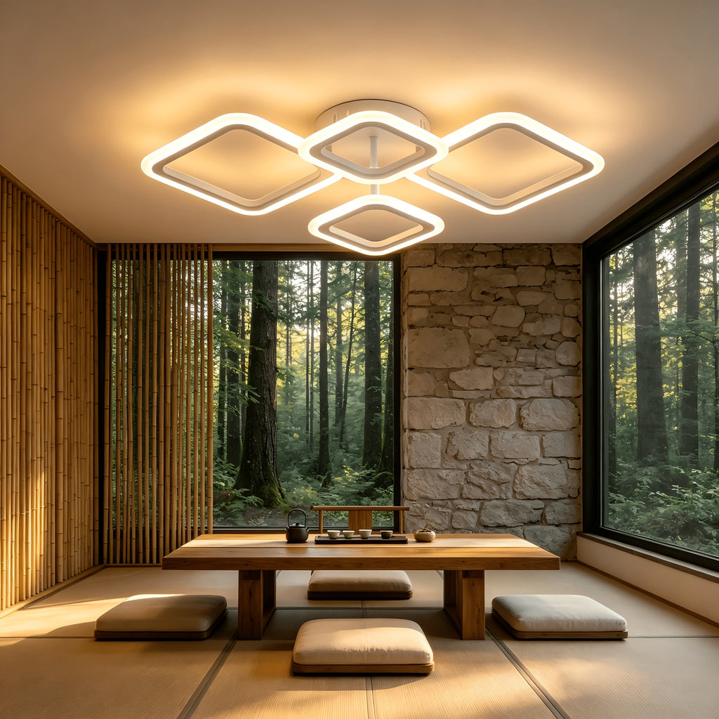 White four frame ceiling light above a low indoor dining table