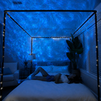 Galaxy projector creating a multicolor star field in a living room
