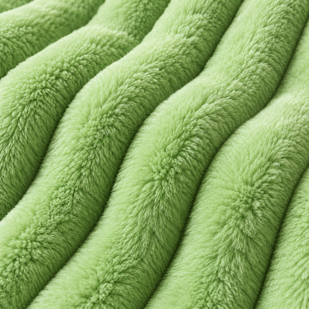 Macro detail of the Green Tea blanket raised plush ribs and soft fibers