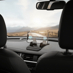 Phone resting in black non-slip dashboard cradle