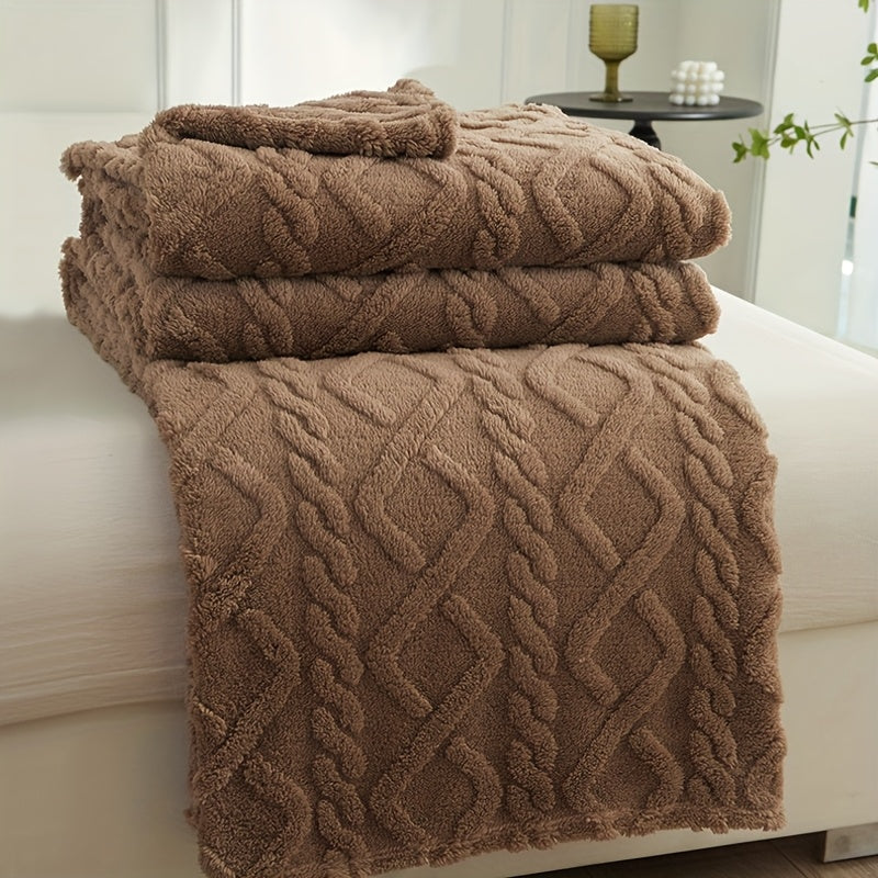 Coffee brown patterned fleece throw folded on a seat