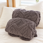 Dark Gray geometric fleece blanket rolled without packaging