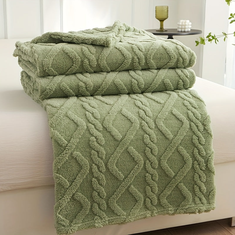 Green jacquard throw showing a folded edge