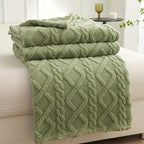Green jacquard throw showing a folded edge