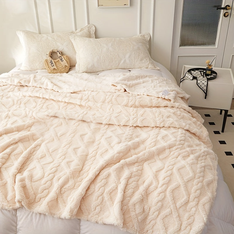 Beige geometric blanket spread across a bed