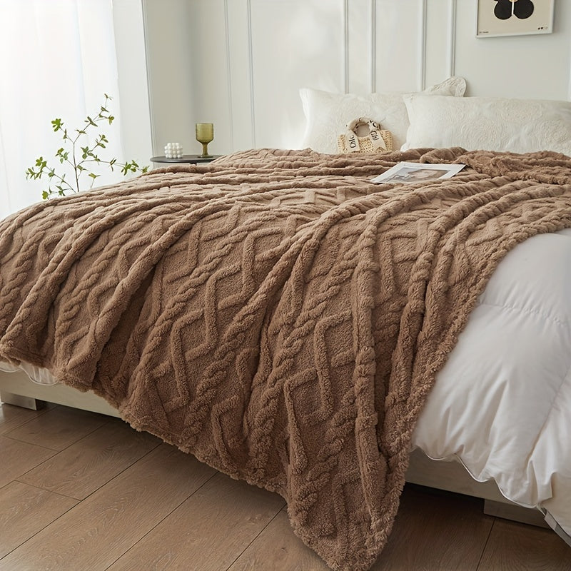 Coffee brown geometric throw on a bed