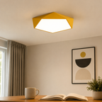 Geometric LED ceiling light installed above a contemporary dining area.