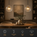 Two pendant light fixtures glowing above a dining table with feature icons along the bottom.