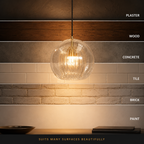 Pendant light glowing against six labeled wall finishes, including plaster, wood, concrete, tile, brick, and paint.