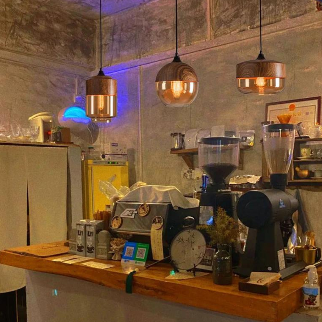 Glass pendant light styles above a coffee counter