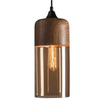 Tall cylindrical glass pendant light with wood look metal upper section