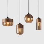 Glass pendant light styles displayed together against a gray background