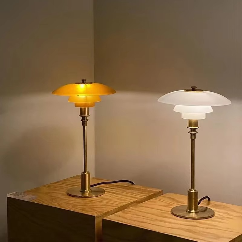 Glass table lamp pair showing amber and white shades
