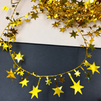 Gold star garland detail showing metallic star shapes along the strand.