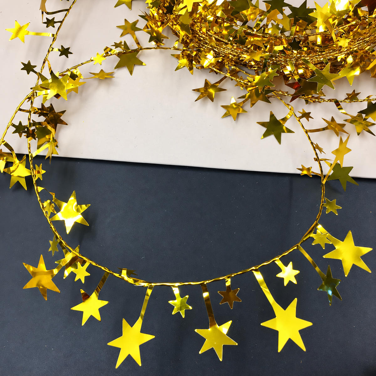 Gold star garland detail showing metallic star shapes along the strand.
