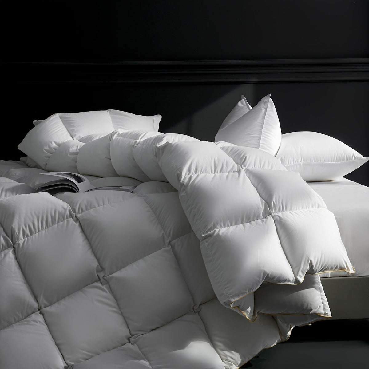 White quilted down and feather duvet in a dramatic bedroom setting