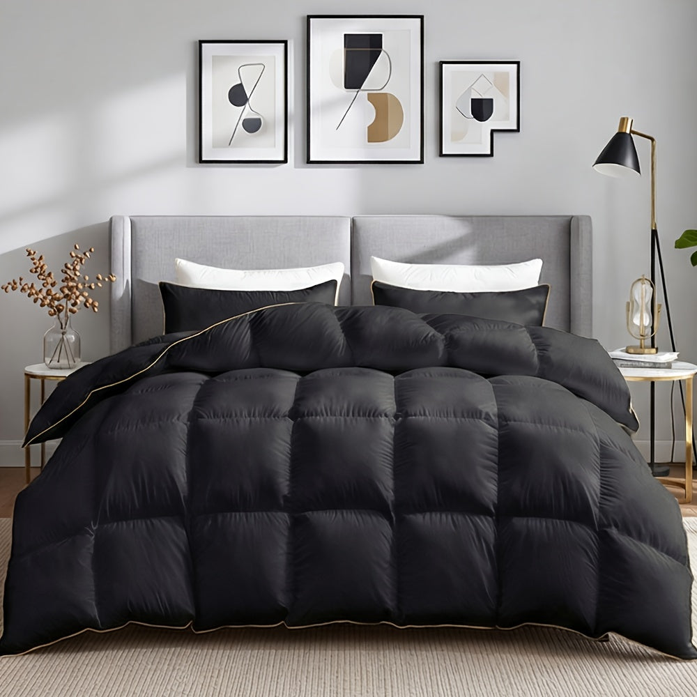 Black duvet with golden edge binding on a bed