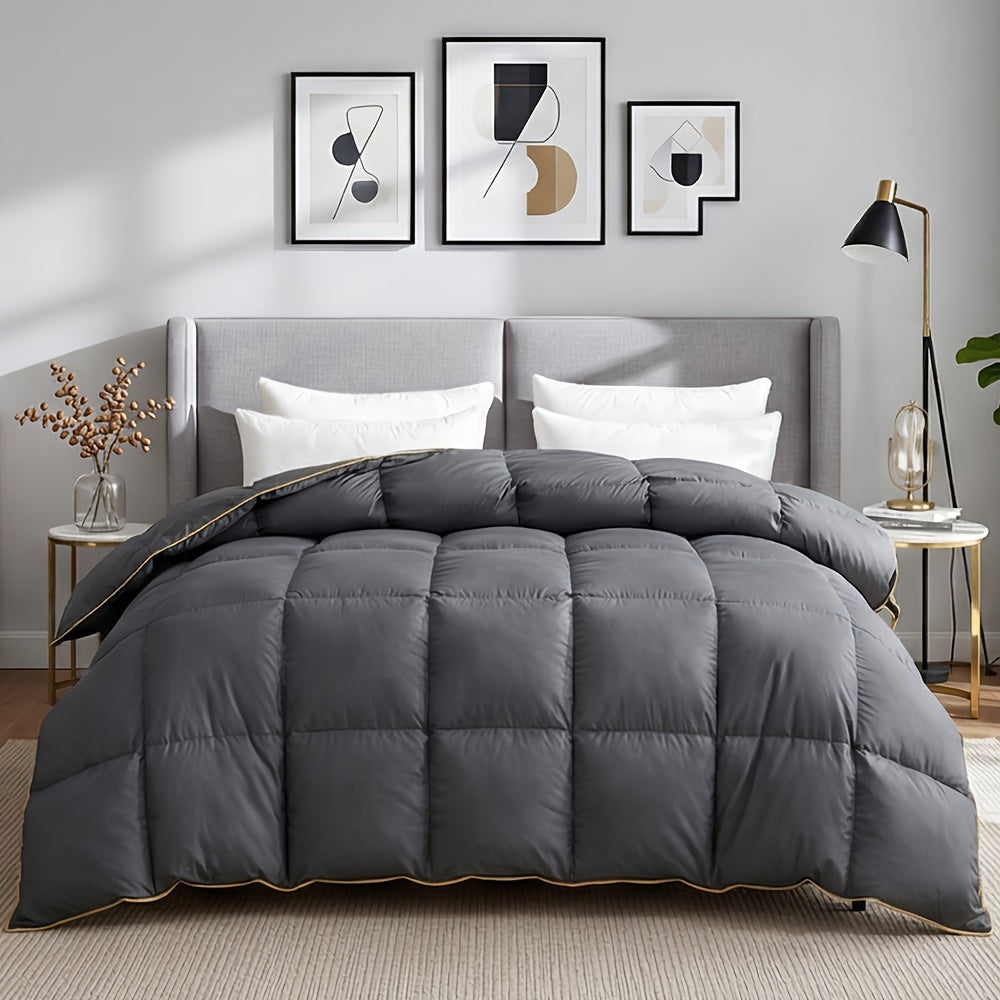 Gray duvet with golden binding in a modern bedroom