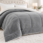 Closer bedroom view of gray box quilted comforter