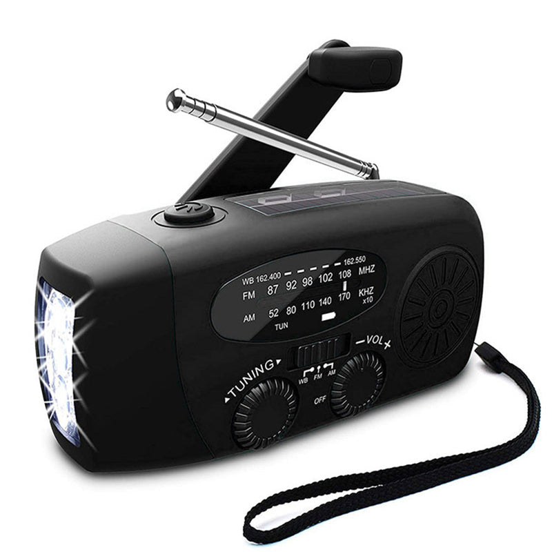 Black AM FM radio with raised hand crank, extendable antenna, flashlight, and strap