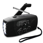 Black AM FM radio with raised hand crank, extendable antenna, flashlight, and strap