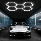 Hexagon LED garage light with five connected grids above a silver car.