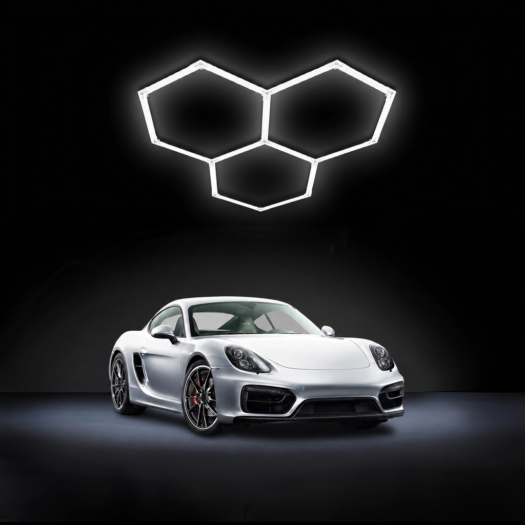 Hexagon LED garage light with three connected grids above a silver car.