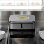 Gray ceramic hot plate with front touch controls