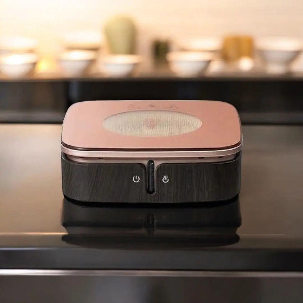 Rose gold ceramic hot plate with dark front panel