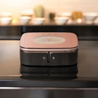 Rose gold ceramic hot plate with dark front panel