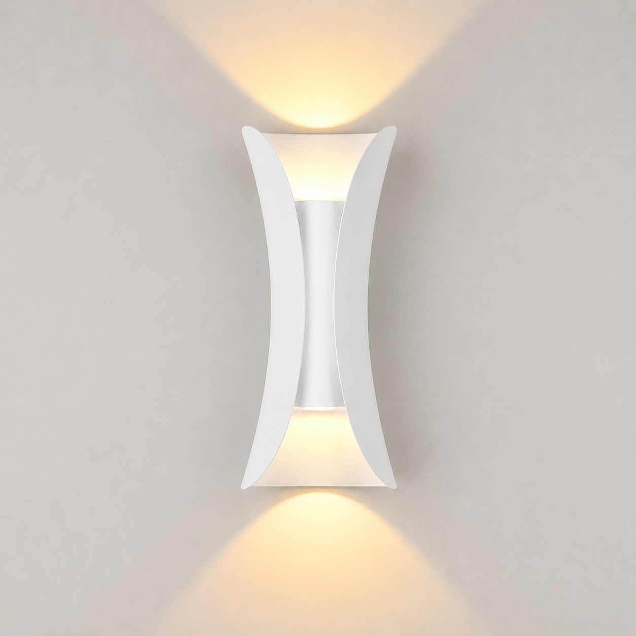 White outdoor wall sconce mounted on a light wall, casting warm light upward and downward.