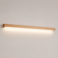 Wooden linear wall sconce glowing against a clean neutral background.