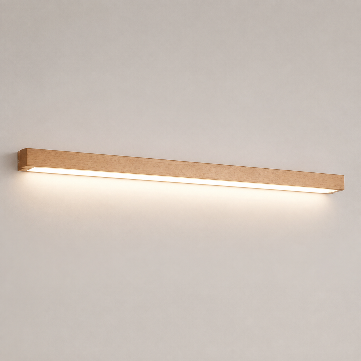 Wooden linear wall sconce glowing against a clean neutral background.