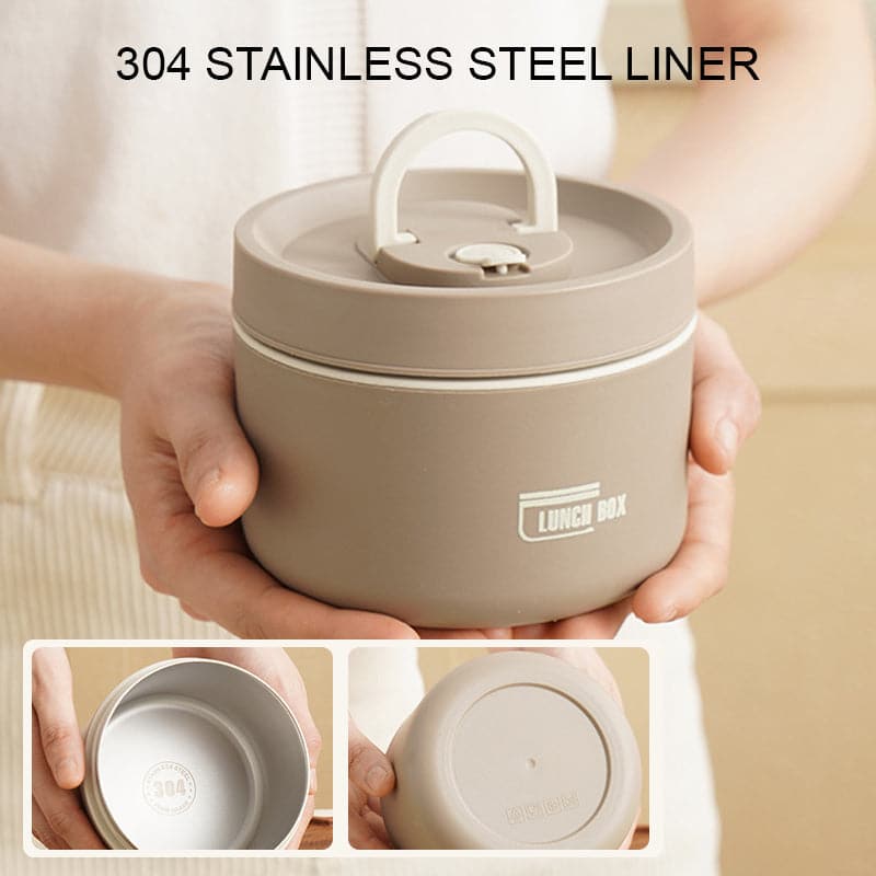 Insulated lunch box in white held open to show the stainless steel liner.